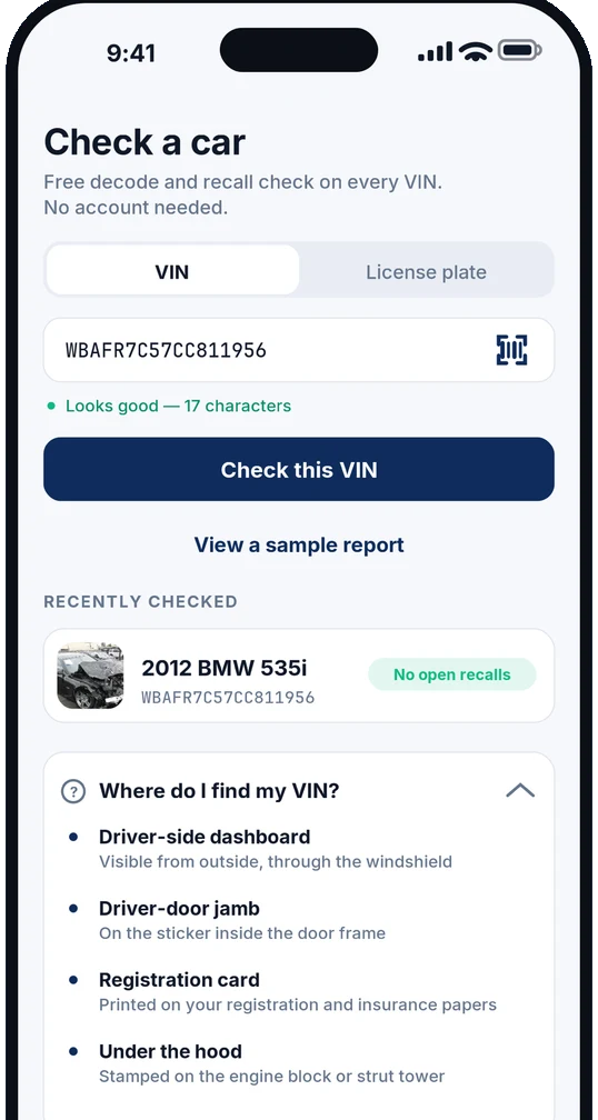 Home screen of the CarCheckerVIN app with VIN and License plate tabs side by side, a VIN field showing a scan icon and a 17-character validity check, and a panel explaining where to find your VIN