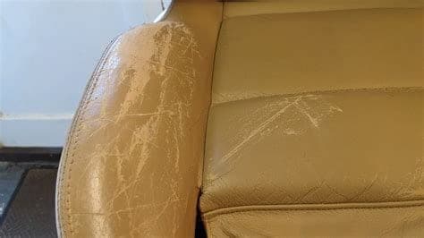 Worn and collapsed driver's seat bolster on a high-mileage vehicle