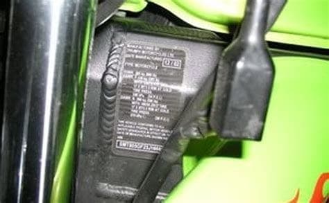 Close-up of a motorcycle VIN plate stamped into the steering head frame