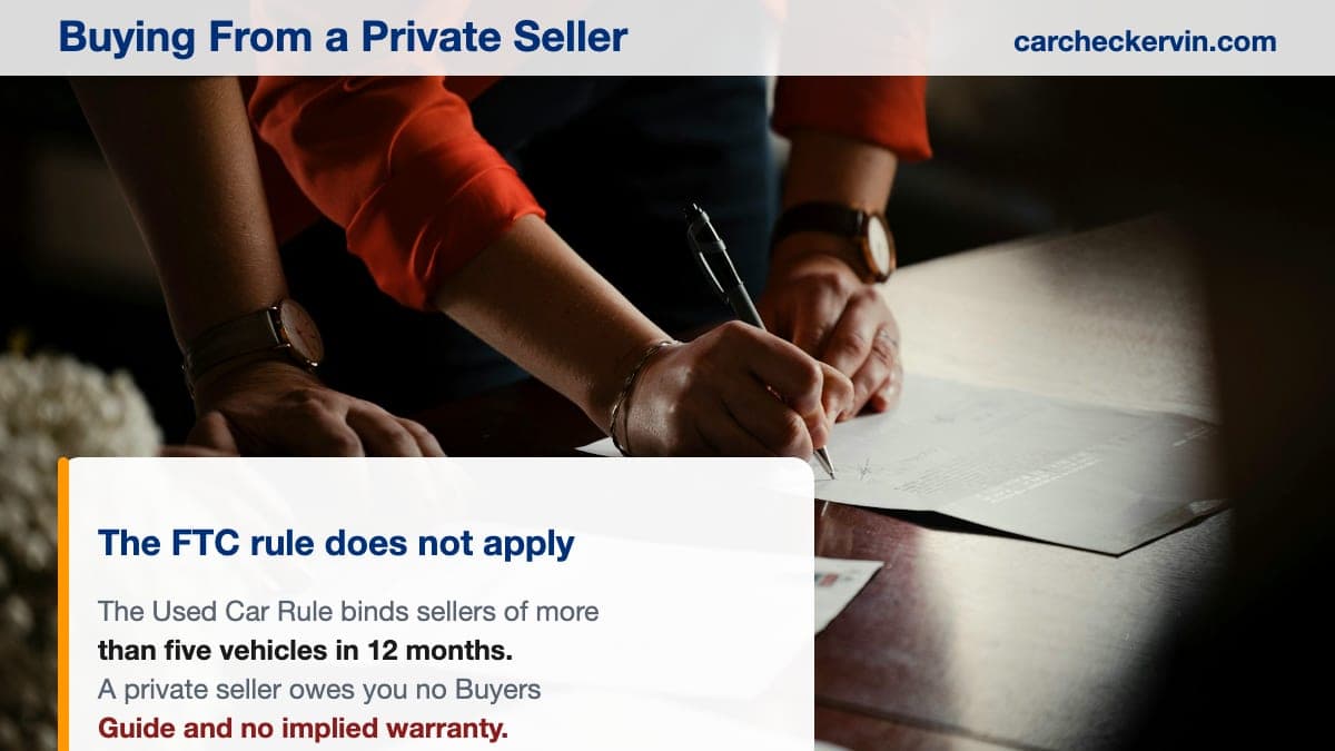 Two people completing the paperwork for a private used-car sale