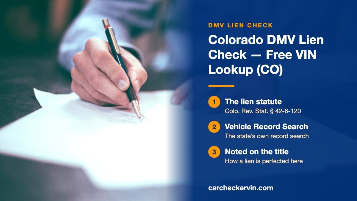 Someone in Colorado signing a document at a desk with a ballpoint pen