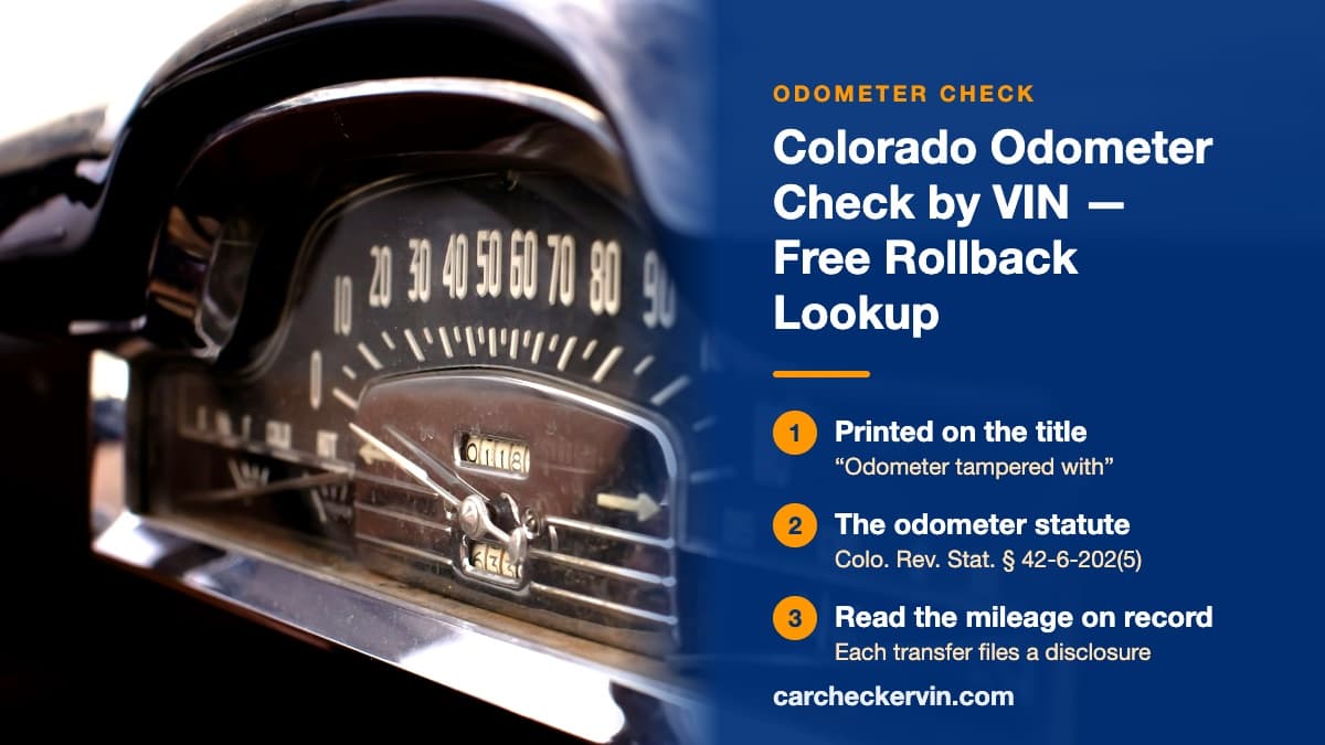 A vintage car's chrome speedometer and mechanical odometer drum in Colorado